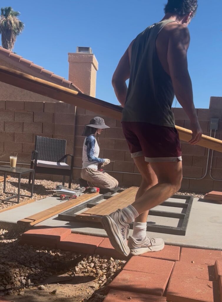Timmy helping with materials during the construction of our backyard wooden sauna.
